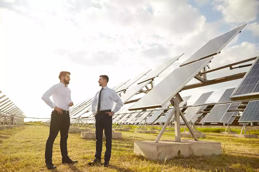 businessmen-talking-on-solar-power-plant-2023-11-27-04-52-16-utc